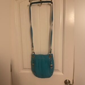 B Makowsky turquoise, leather Crossbody bag can convert to double strap arm bag.